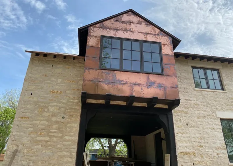 Copper metal panel facade on a stone building for Roof Repair in Prescott Valley